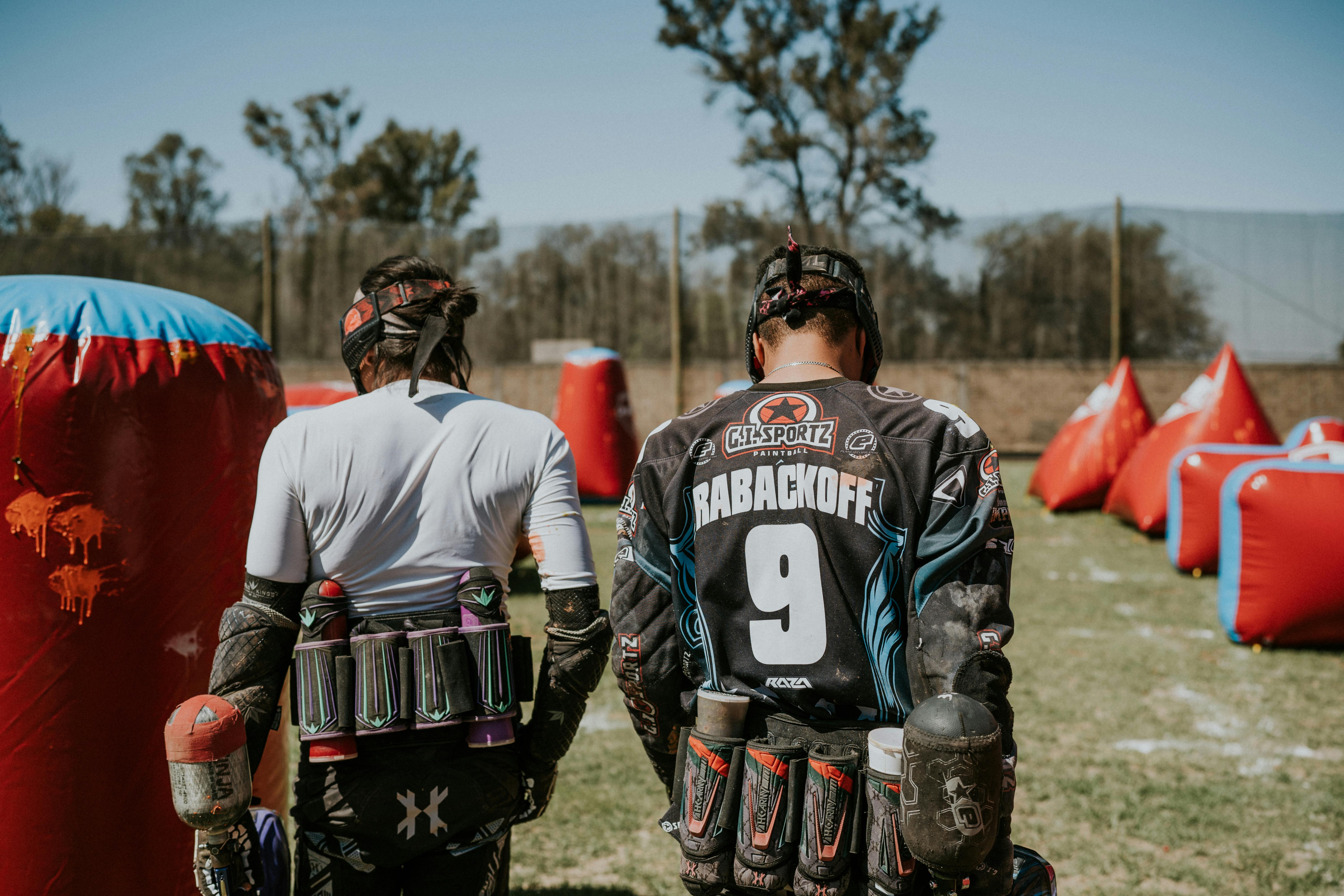 Players moving through a paintball field