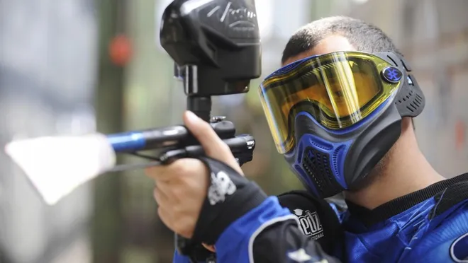 Paintball players in action